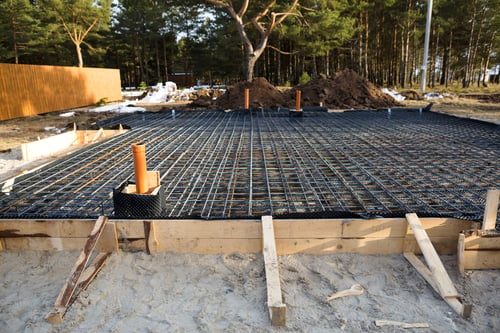 Reinforced concrete slab with rebar mat and waterproofing layer ready for pour